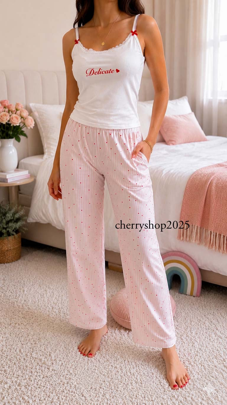 White top and striped salmon trousers with heart print