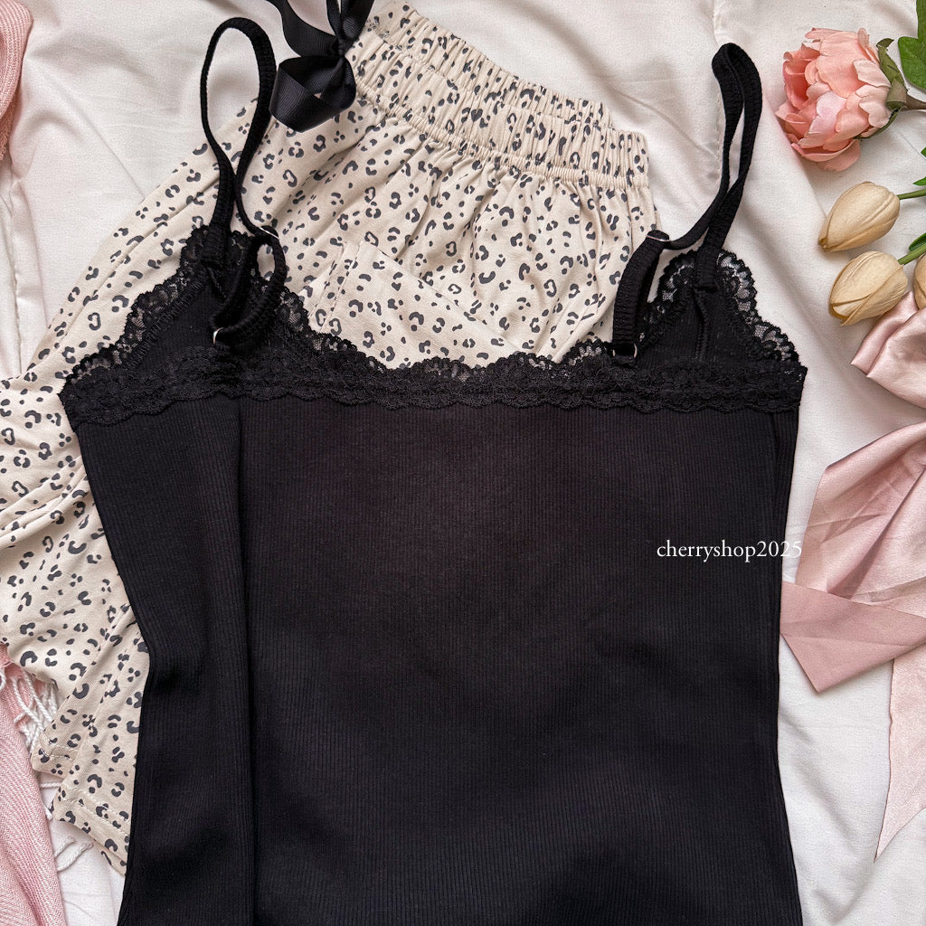Black top and beige tiger pants