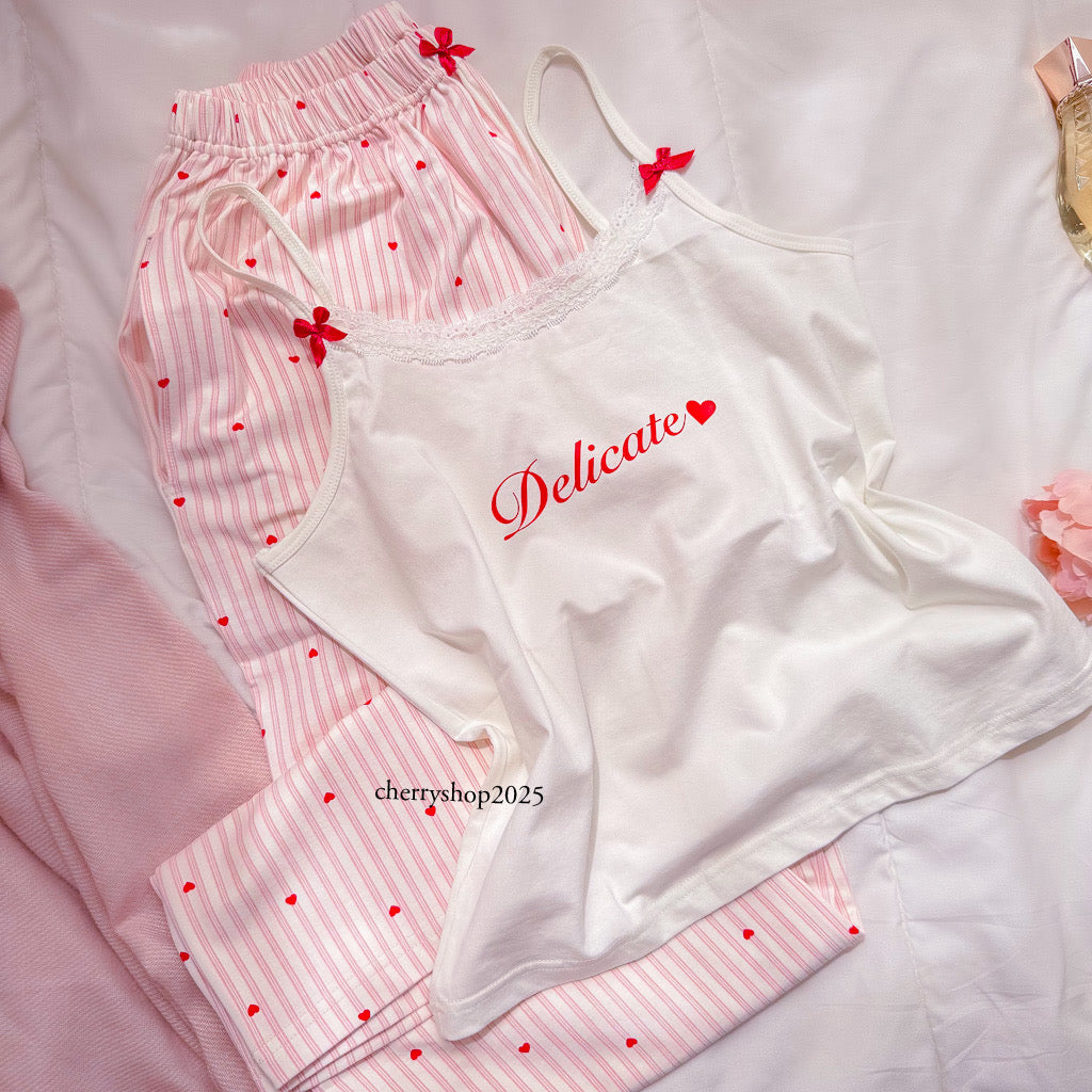 White top and striped salmon trousers with heart print