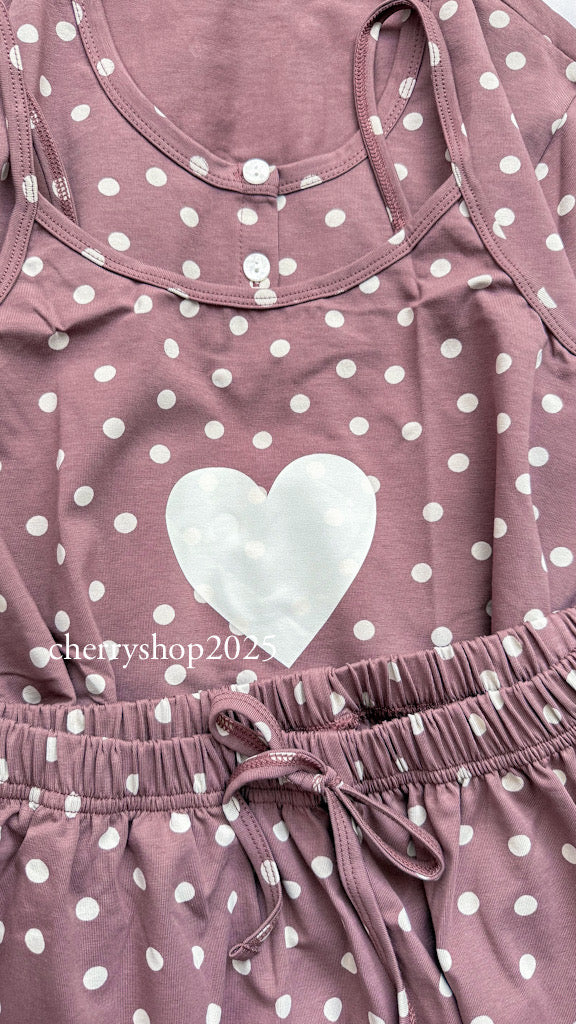 White top and striped salmon trousers with heart print