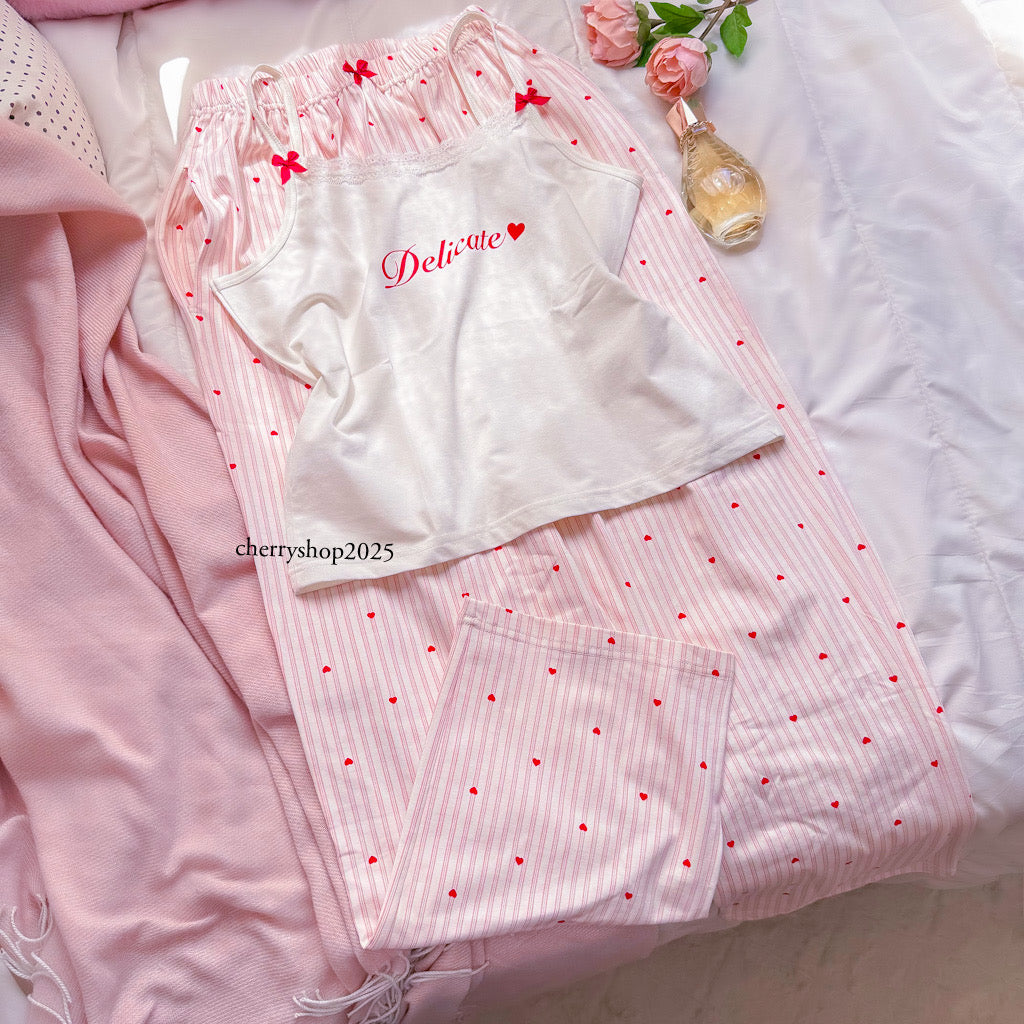 White top and striped salmon trousers with heart print