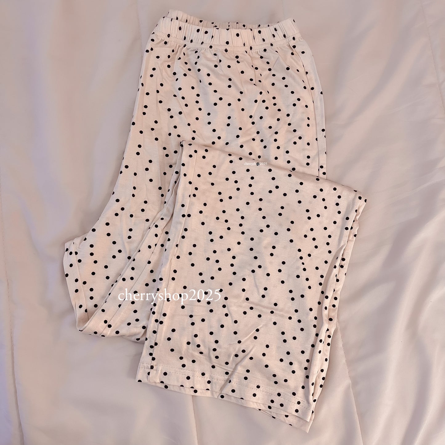 Black polka dot cotton trousers