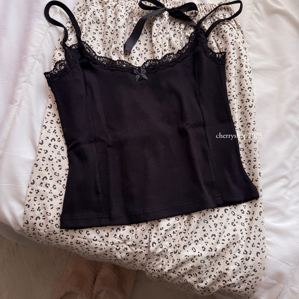 Black top and beige tiger pants
