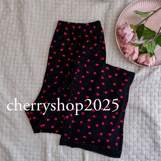 Black pants red hearts